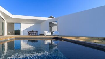 A front view of home with swimming pool