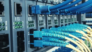 Fiber optic and Ethernet cables in rack